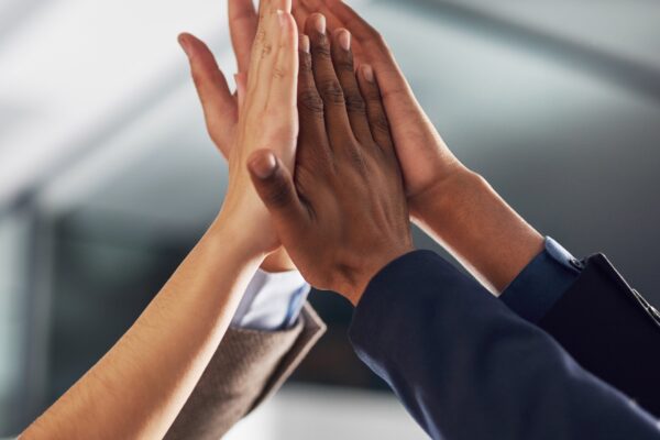 Four hands high-fiving