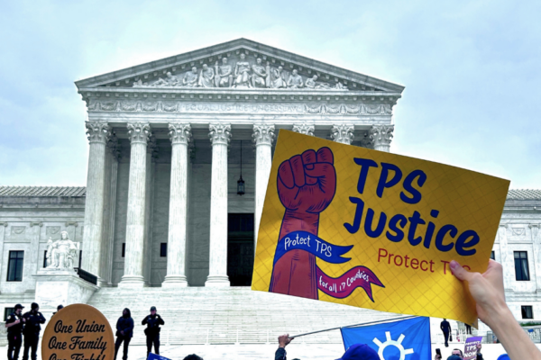 Supreme Court facade with activist holding sign saying "TPS Justice"