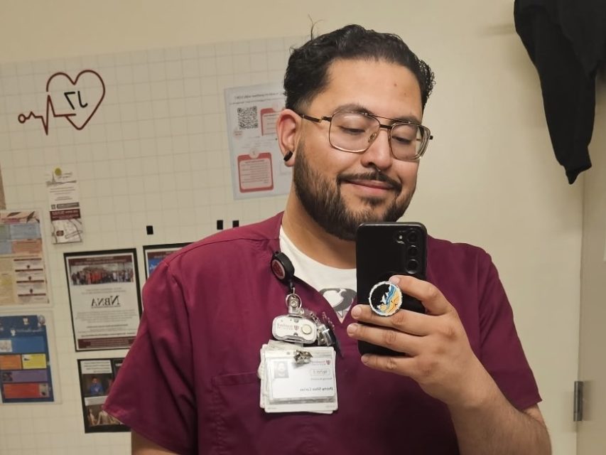Jhony taking a selfie in scrubs