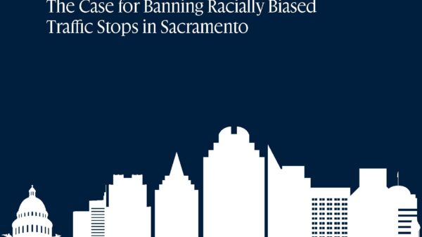 Driving While Black and Brown: The Case for Banning Racially Biased Traffic Stops in Sacramento in light blue text on a dark background with an image of the Sacramento skyline in white.