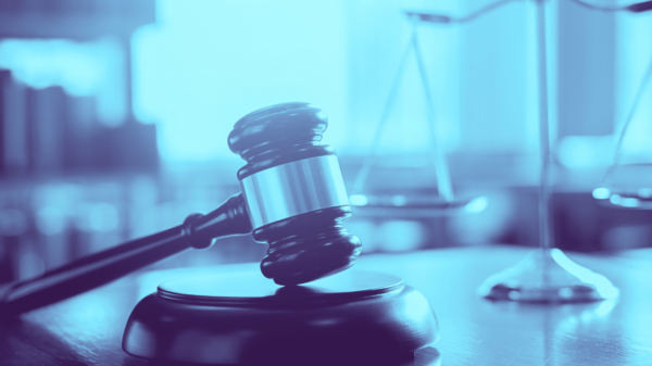 gavel and scales of justice with blue filter