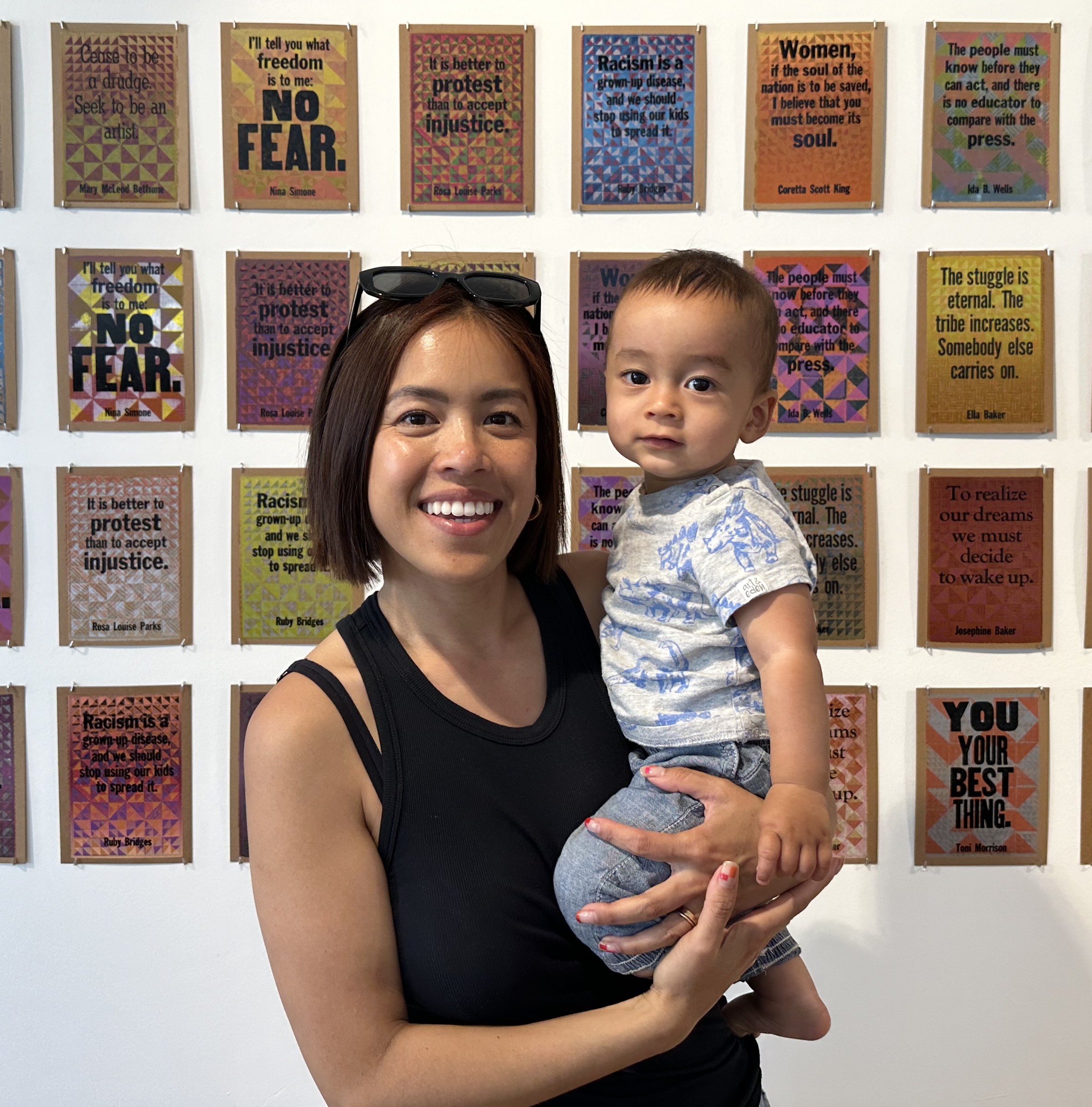 ACLU NorCAl volunteer Melissa Ploysophon holding her child